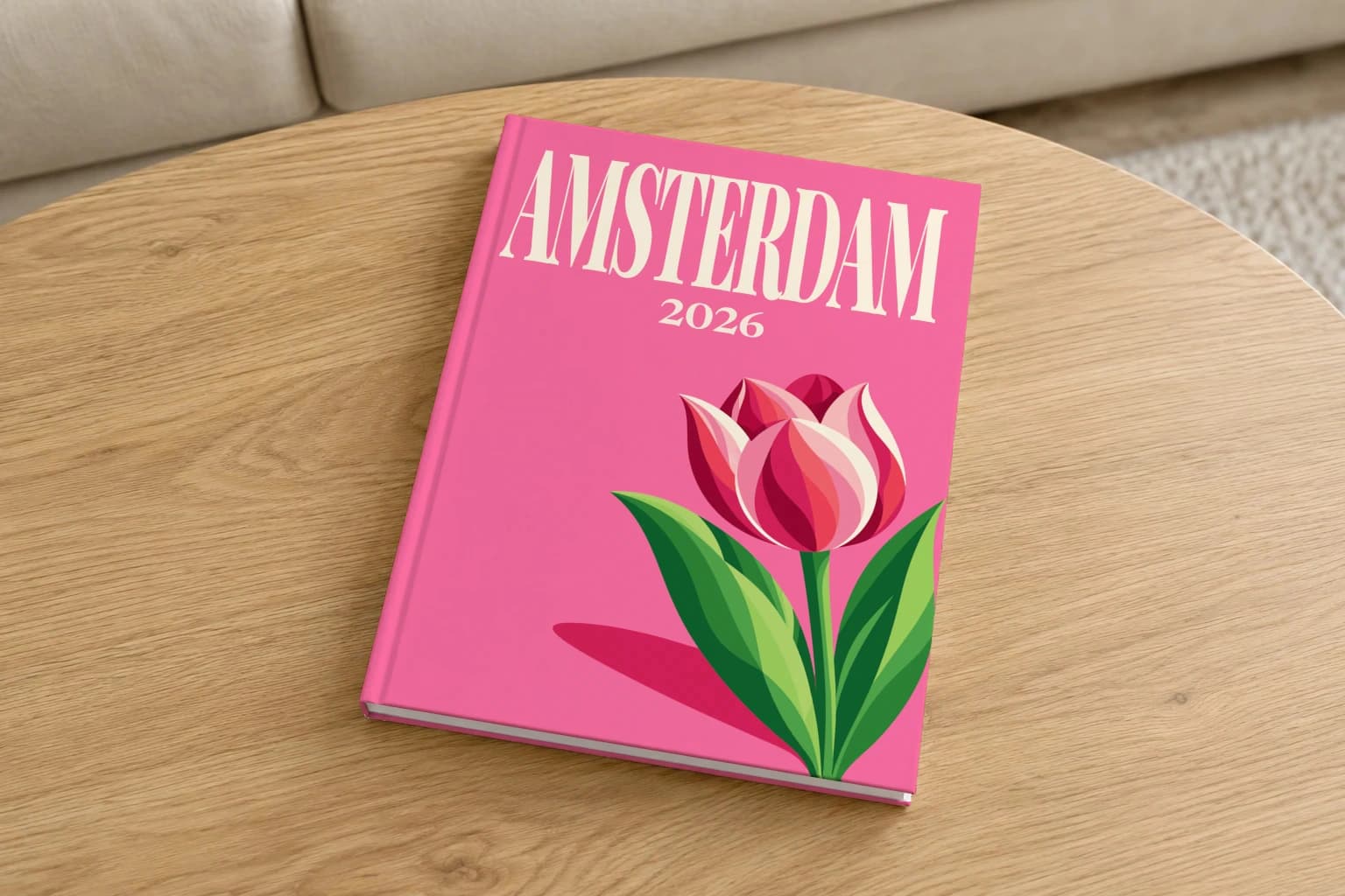 Amsterdam hardcover photo book with the illustrated cover of the tulip, on a round oak coffee table in a bright living room