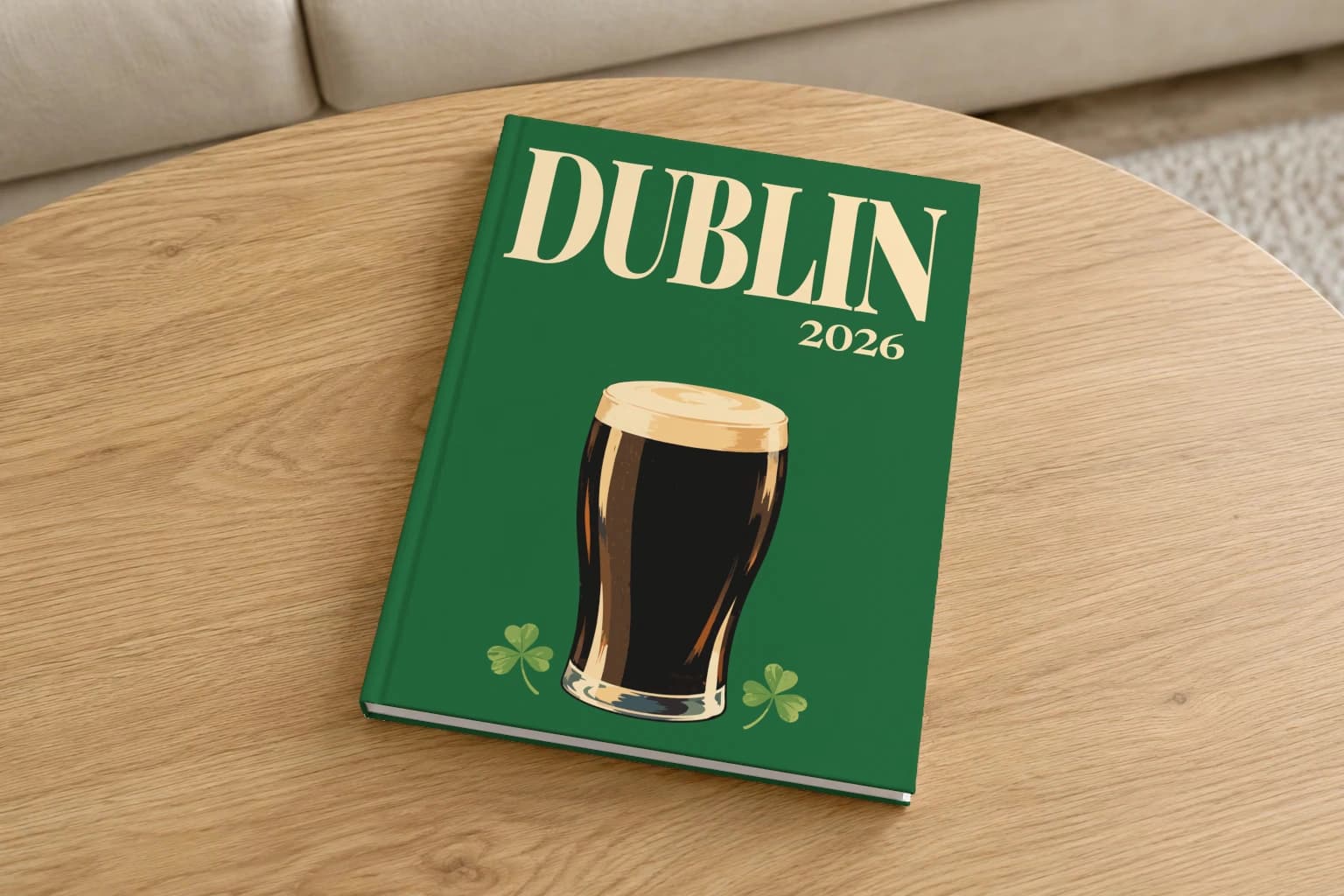 Dublin hardcover photo book with the illustrated cover of the pint of stout, on a round oak coffee table in a bright living room