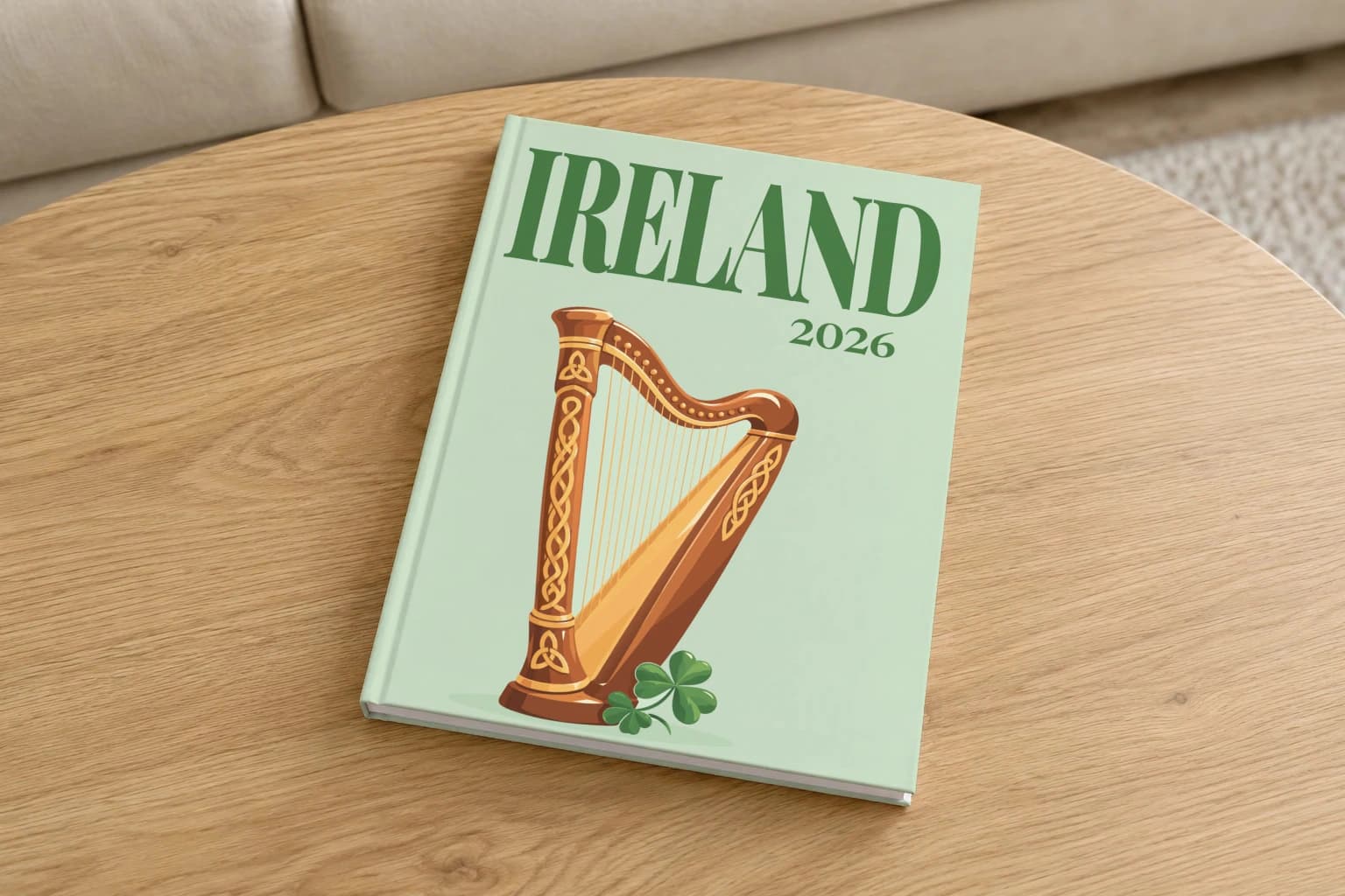 Ireland hardcover photo book with the illustrated cover of the Celtic harp, on a round oak coffee table in a bright living room