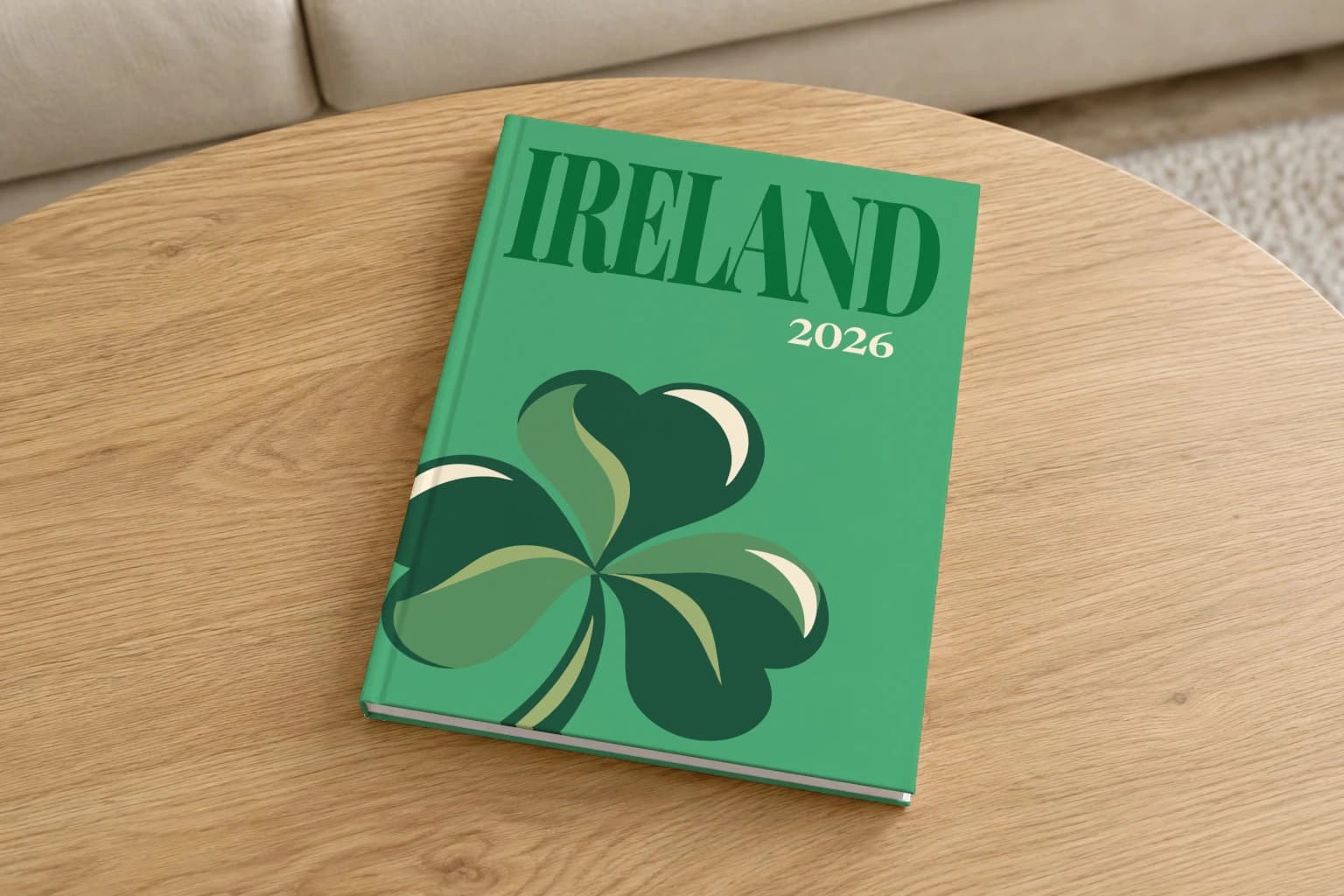 Ireland hardcover photo book with the illustrated cover of a green shamrock on green, on a round oak coffee table in a bright living room