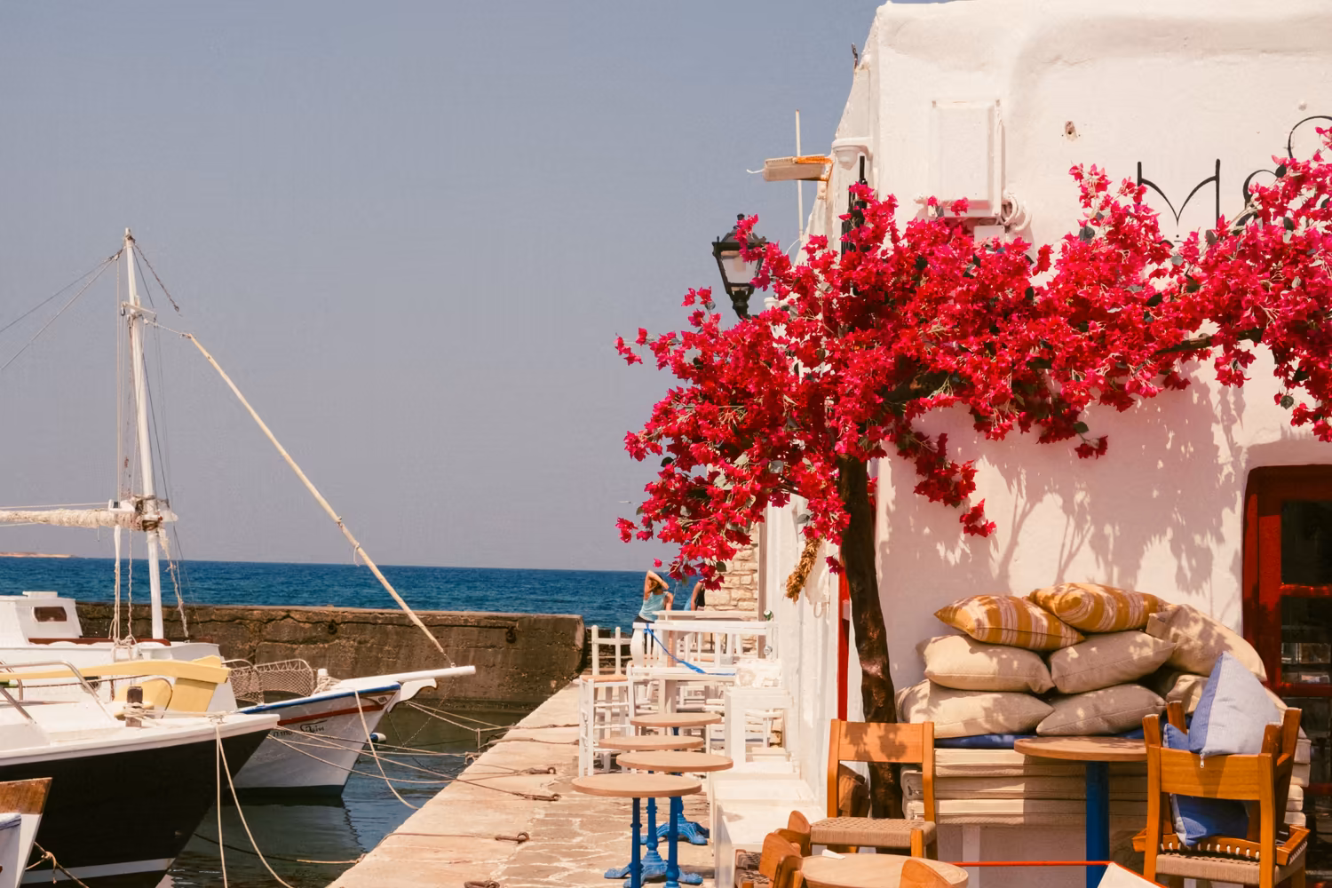 Greek island harbour with bougainvillea for a collaborative group travel journal