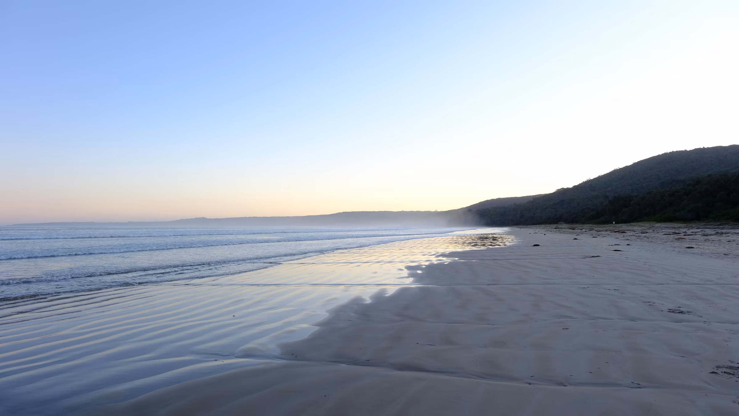 A quiet empty beach at sunset