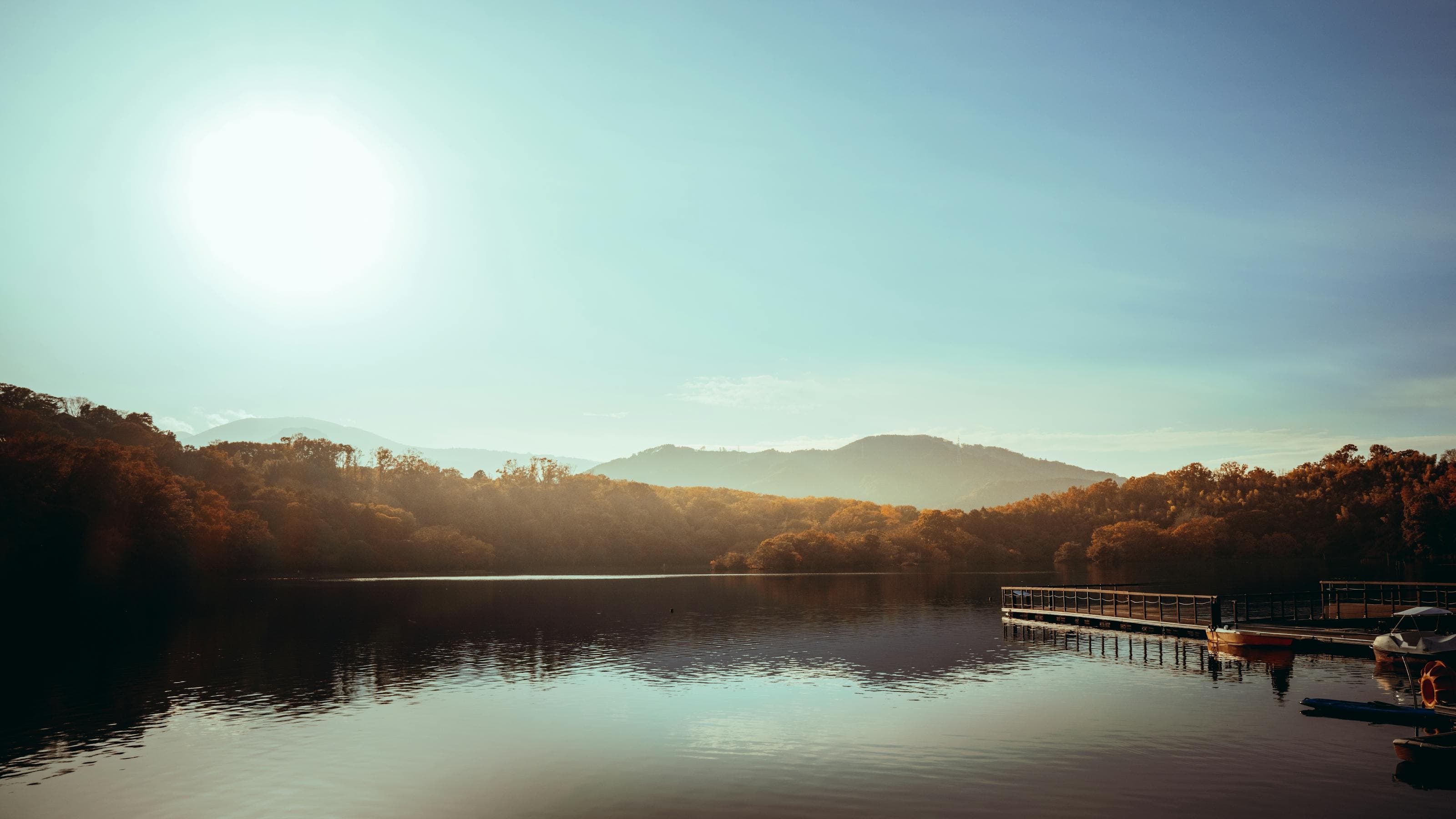 Sunlit lake landscape used as a travel journaling editorial cover