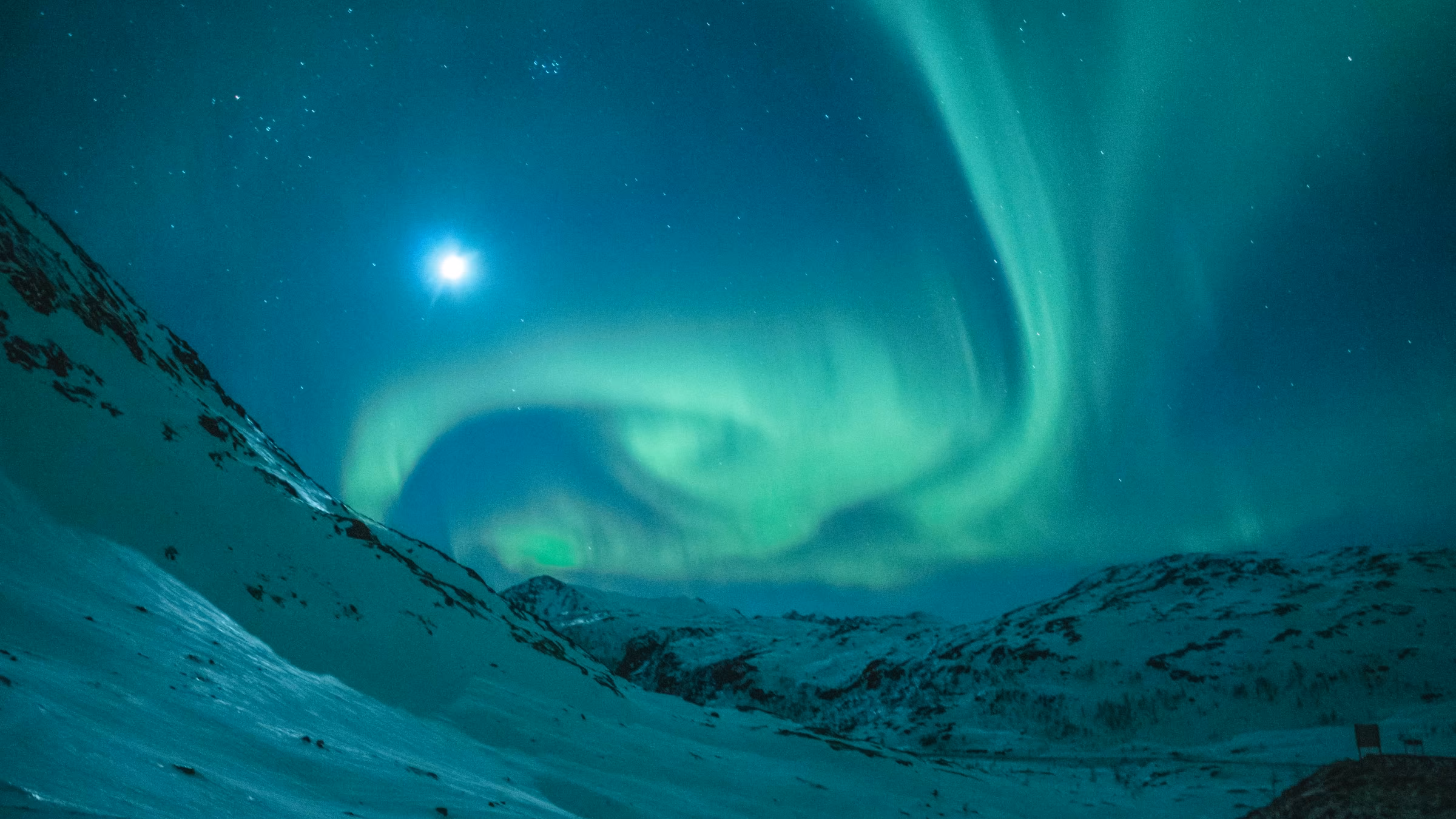 The northern lights glowing above a winter landscape