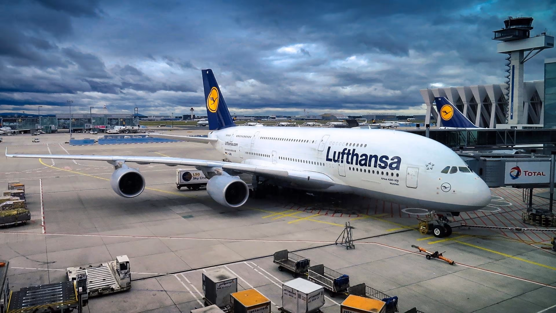 A passenger aeroplane parked at an airport terminal