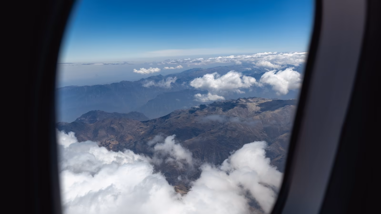 Mountain peaks and clouds seen from an aeroplane