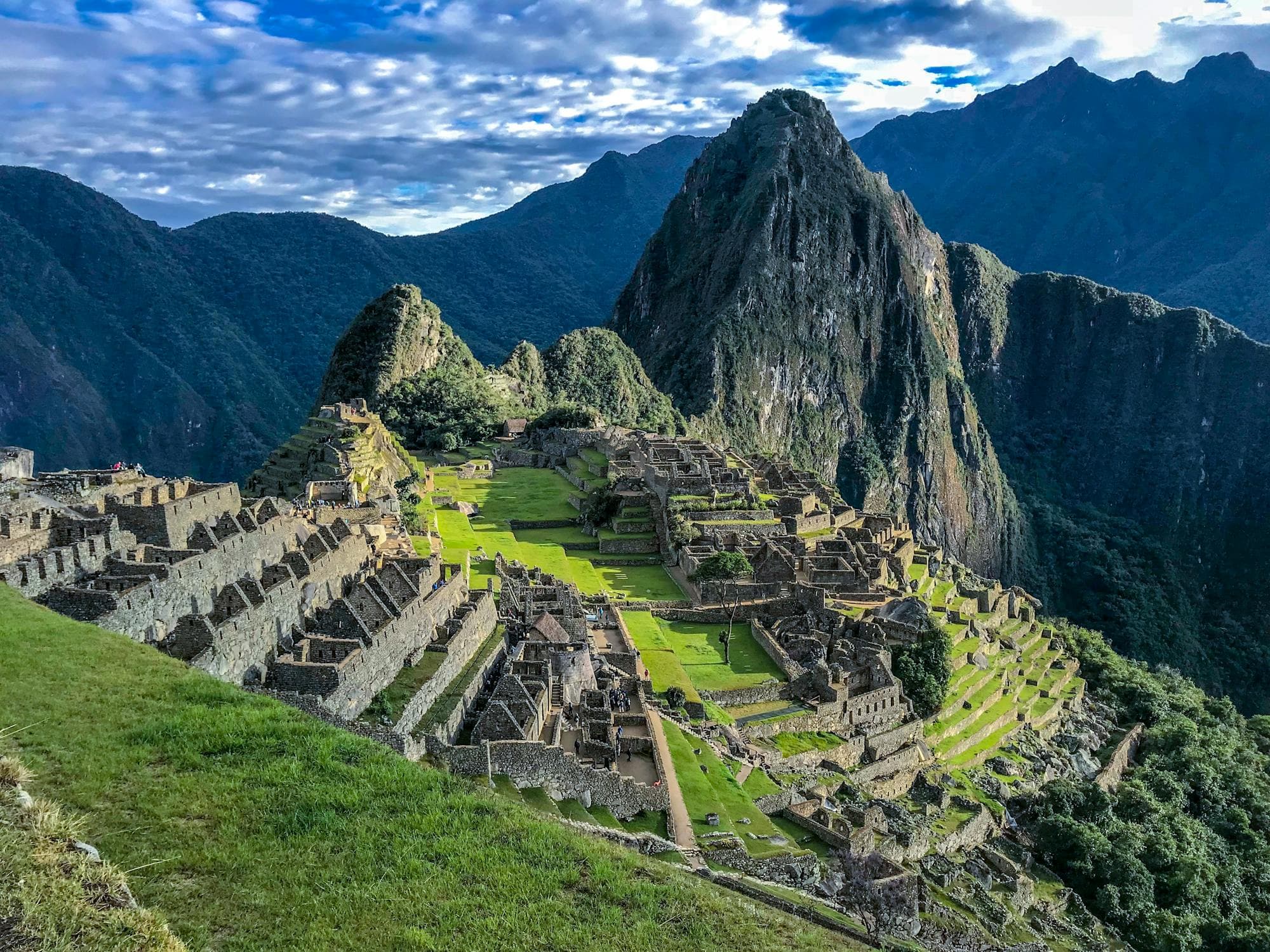 Machu Picchu citadel emerging from morning mist with Huayna Picchu behind it, Peru