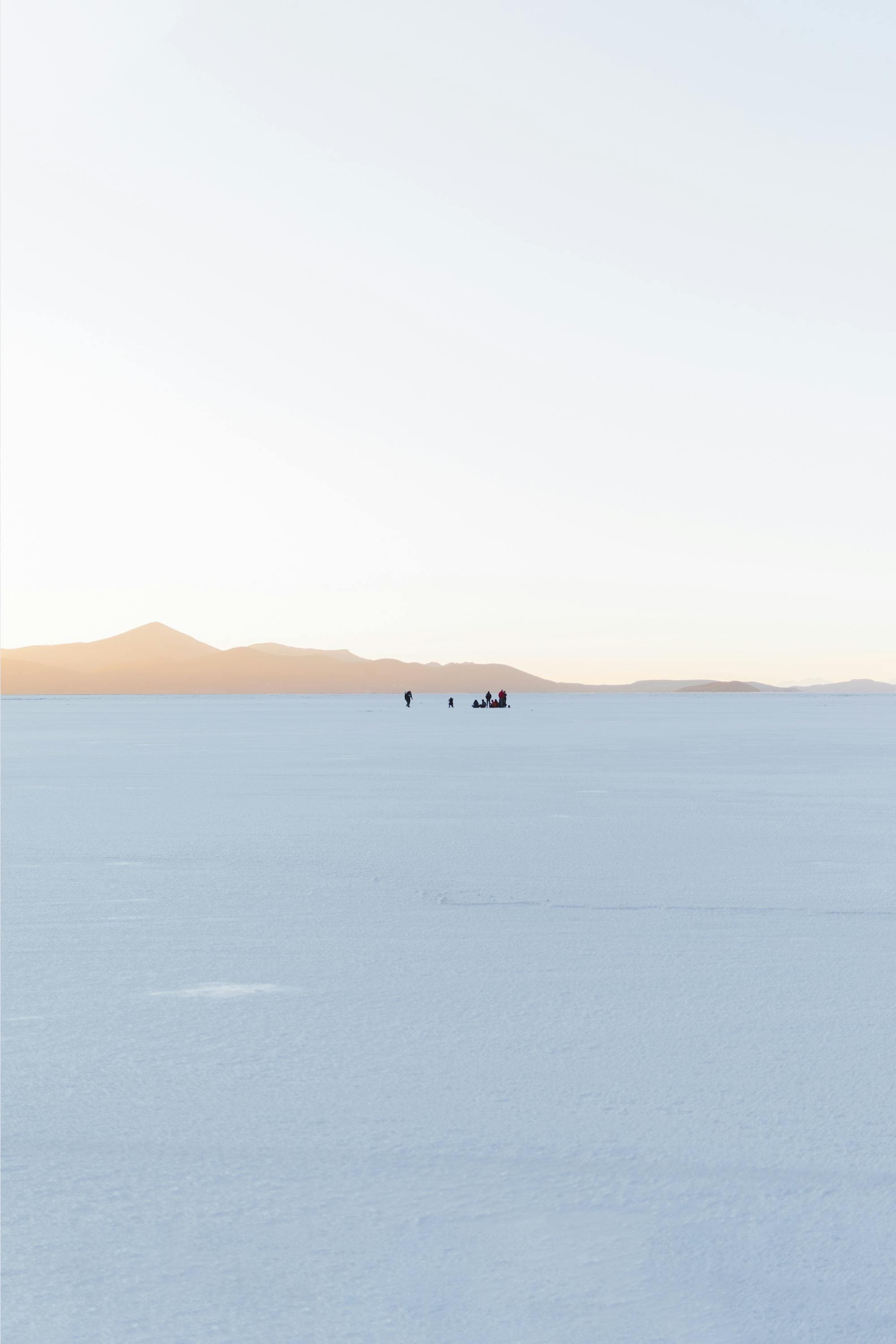 Reflective salt flats of Salar de Uyuni mirroring clouds in Bolivia