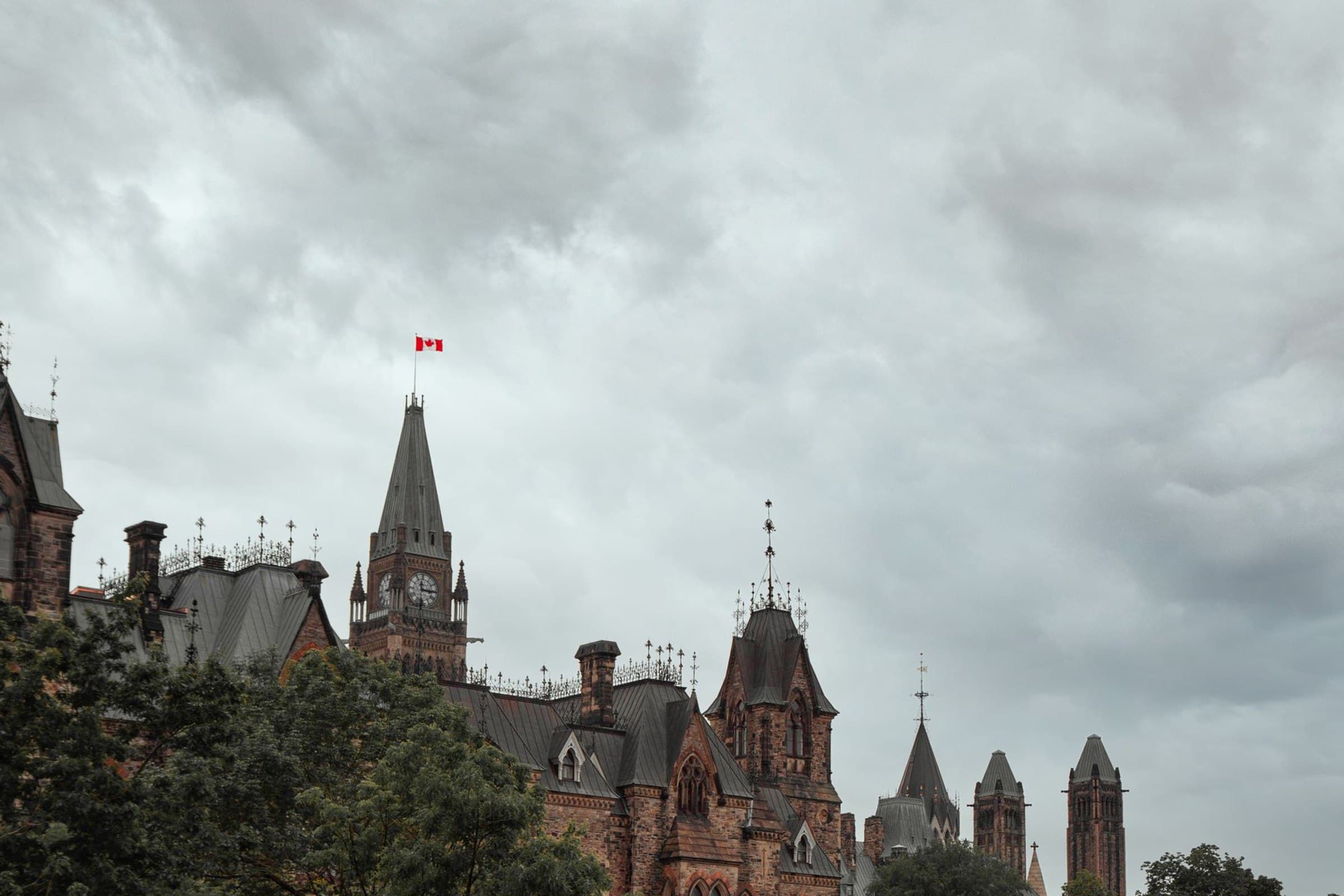 Parliament Hill in Ottawa beneath a dramatic sky