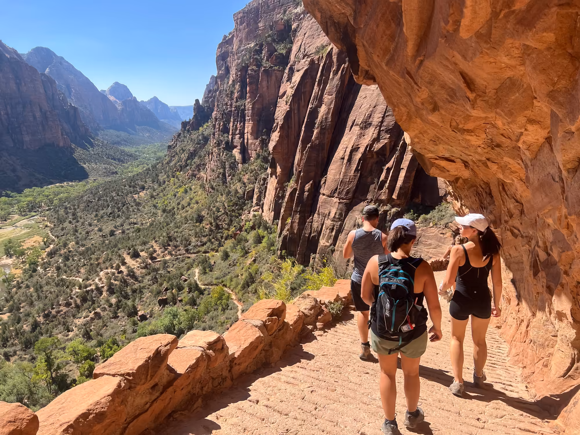 Hikers on the Angels Landing trail in Zion National Park, the kind of trip day that becomes a digital travel scrapbook page