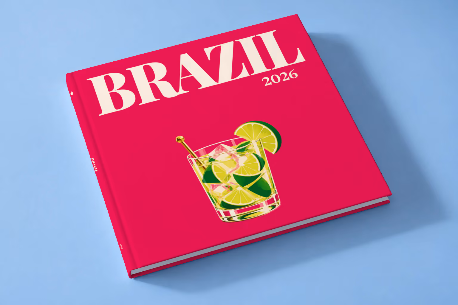 Brazil square hardcover photo book with the illustrated cover of a caipirinha with lime wedges on magenta, lying on a pale blue studio backdrop