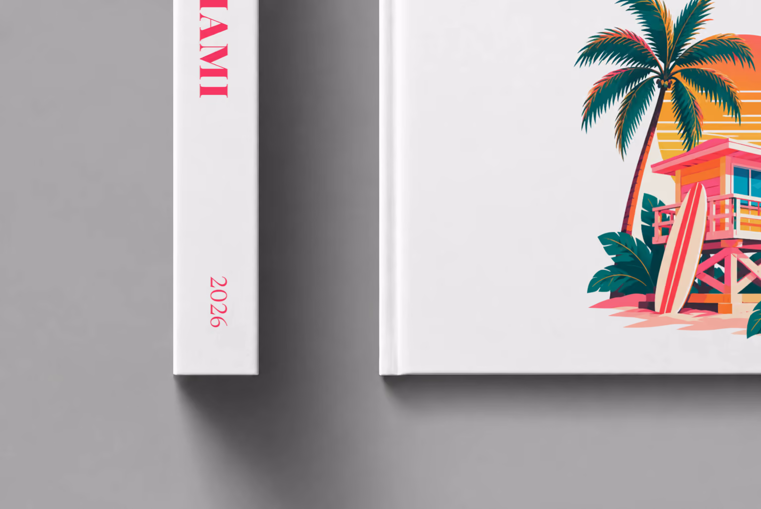 Florida hardcover photo book with the Miami illustrated cover of a pink Miami Beach lifeguard tower with palm trees at sunset on white, shown close up beside its spine on a pale grey studio surface