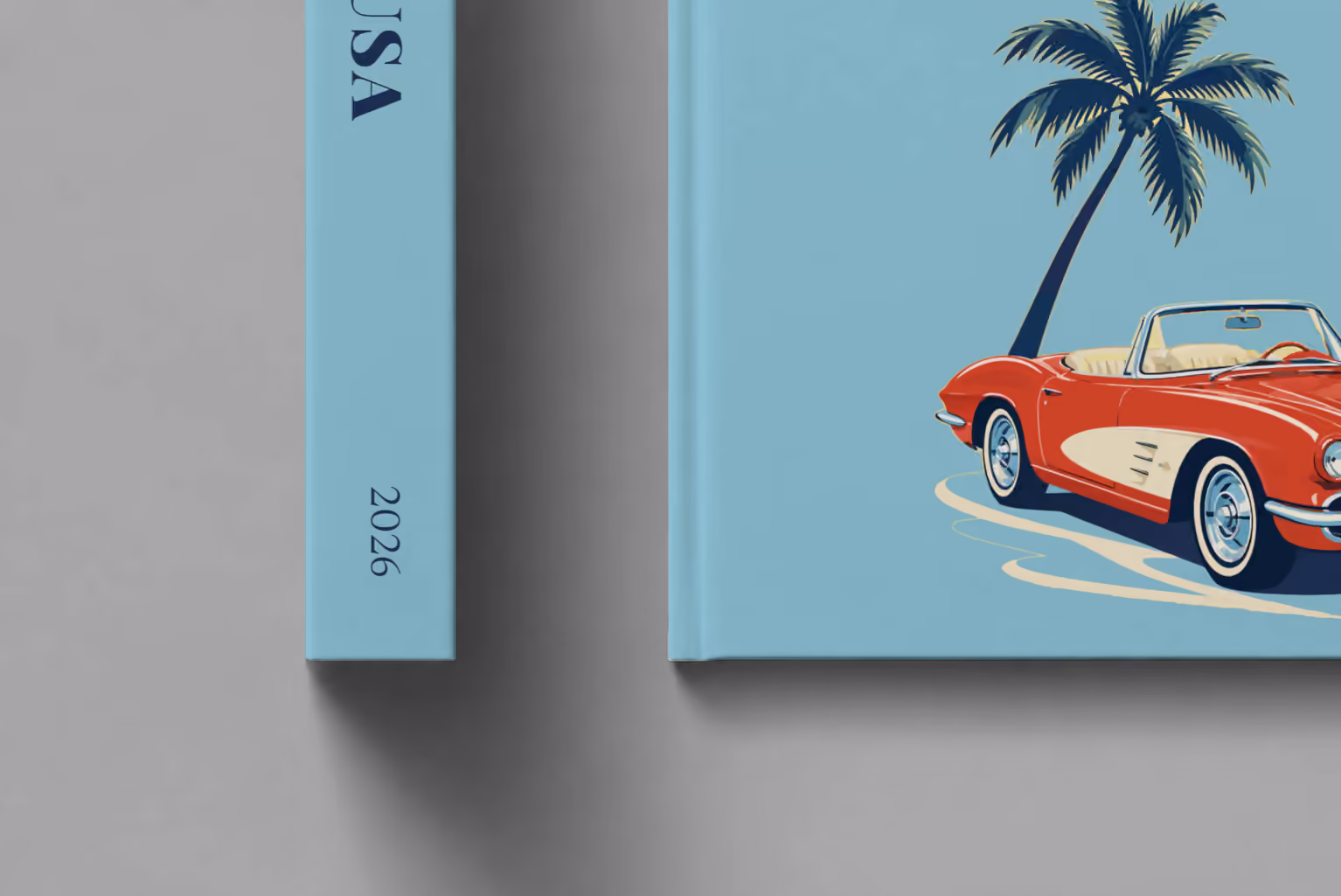 Florida hardcover photo book with the USA illustrated cover of a red Corvette and a palm tree on dusty blue, shown close up beside its spine on a pale grey studio surface