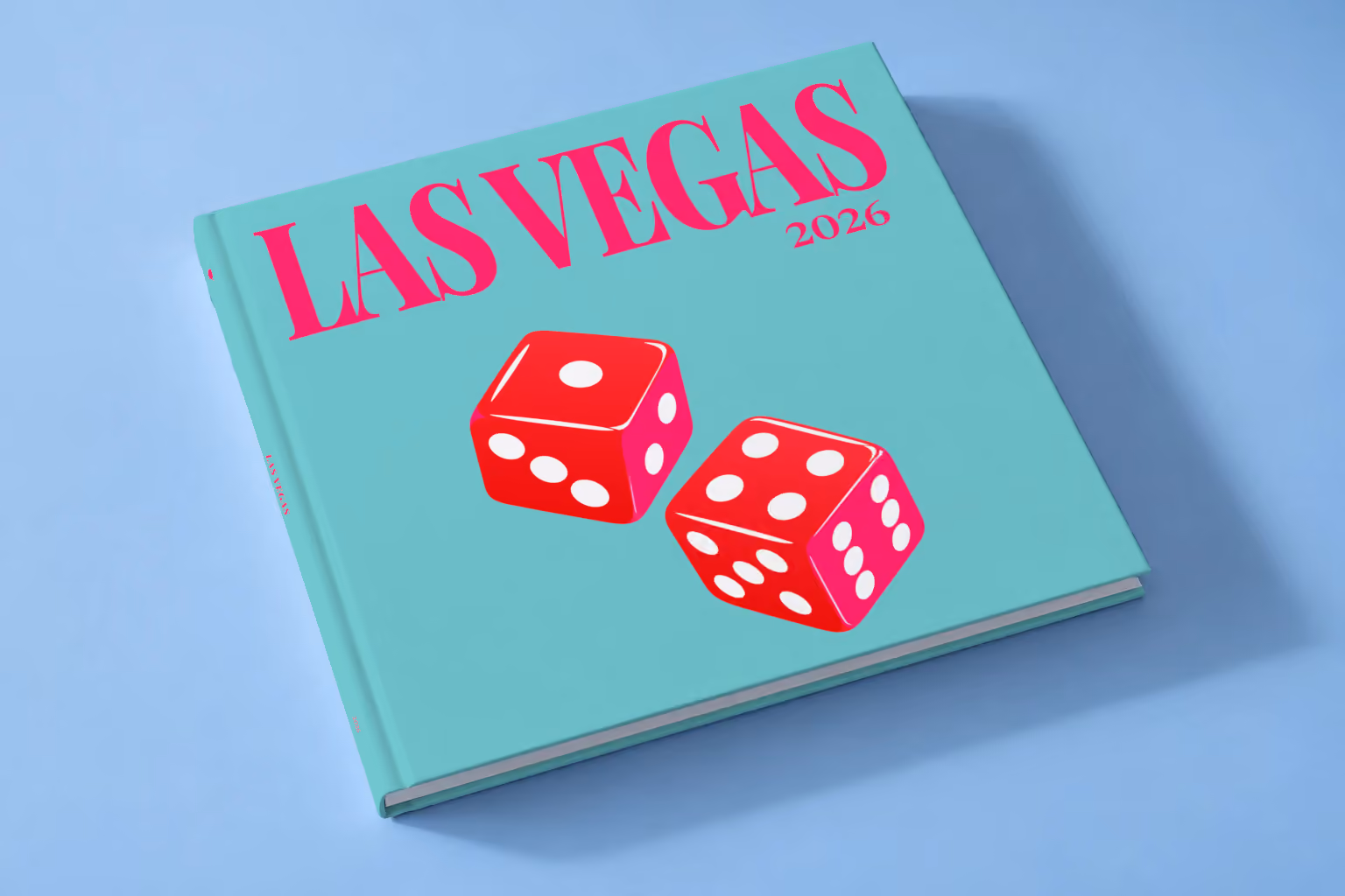 Las Vegas square hardcover photo book with the illustrated cover of a pair of red casino dice on turquoise, lying on a pale blue studio backdrop