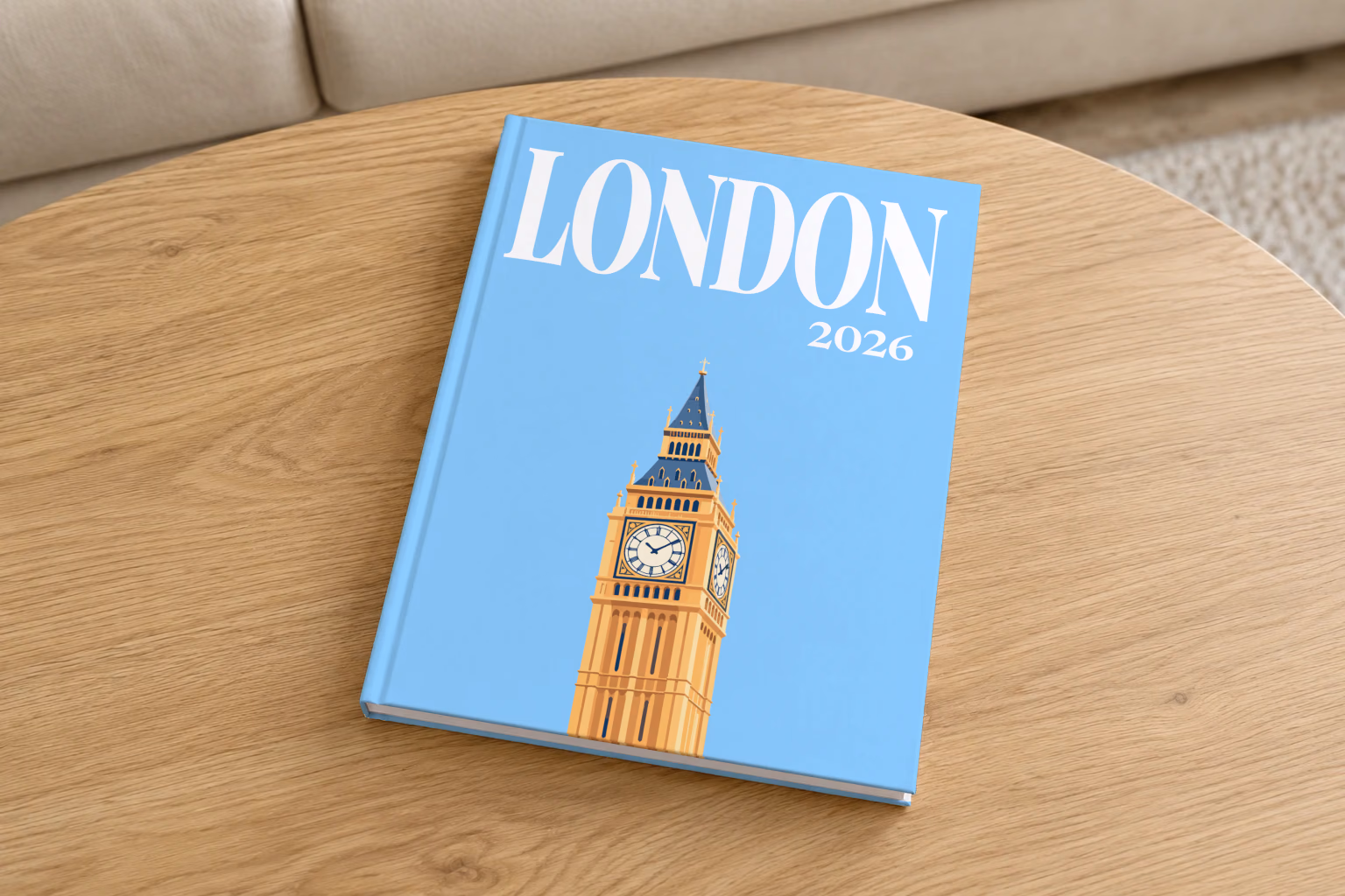 London hardcover photo book with the illustrated cover of Big Ben's Elizabeth Tower on sky blue, on a round oak coffee table in a bright living room