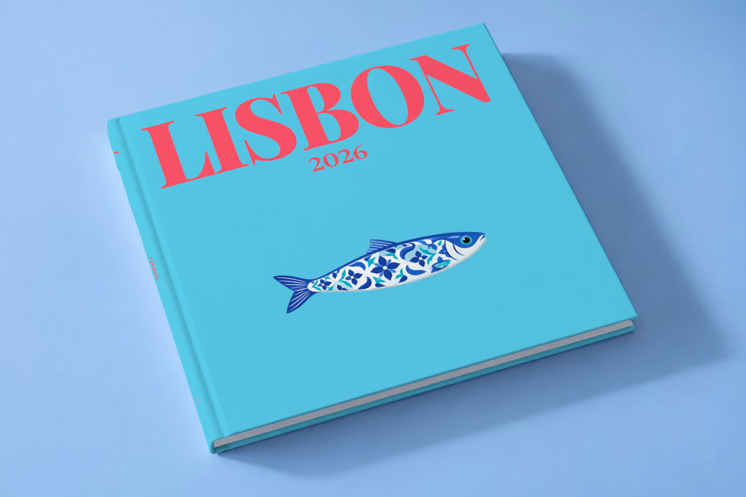 Portugal square hardcover photo book with the Lisbon illustrated cover of a blue azulejo-tiled Portuguese sardine on turquoise, lying on a pale blue studio backdrop