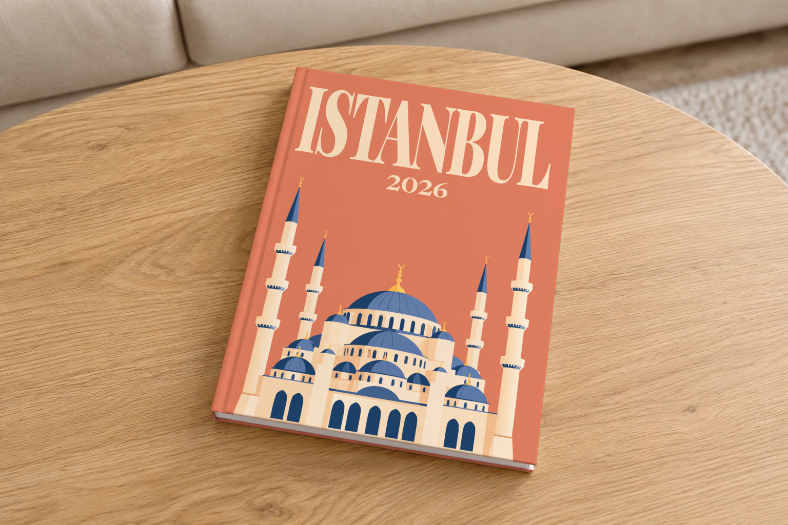 Turkey hardcover photo book with the Istanbul illustrated cover of the domes and minarets of the Blue Mosque on terracotta, on a round oak coffee table in a bright living room