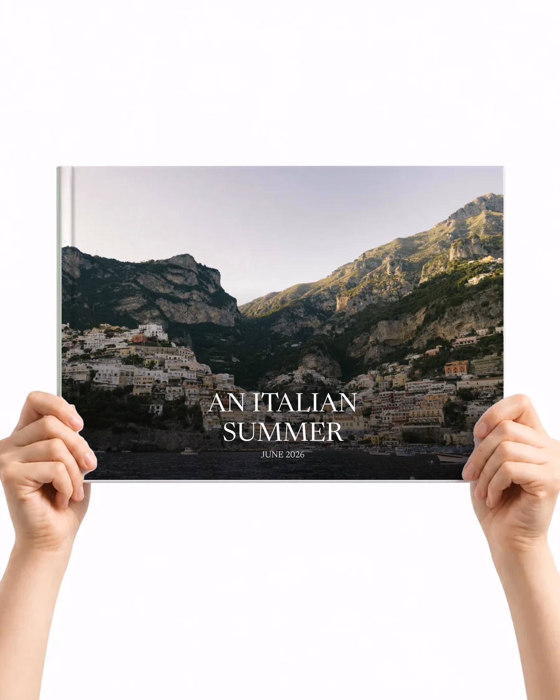 Landscape layflat photo book with an Amalfi Coast photo cover titled An Italian Summer, held up in two hands