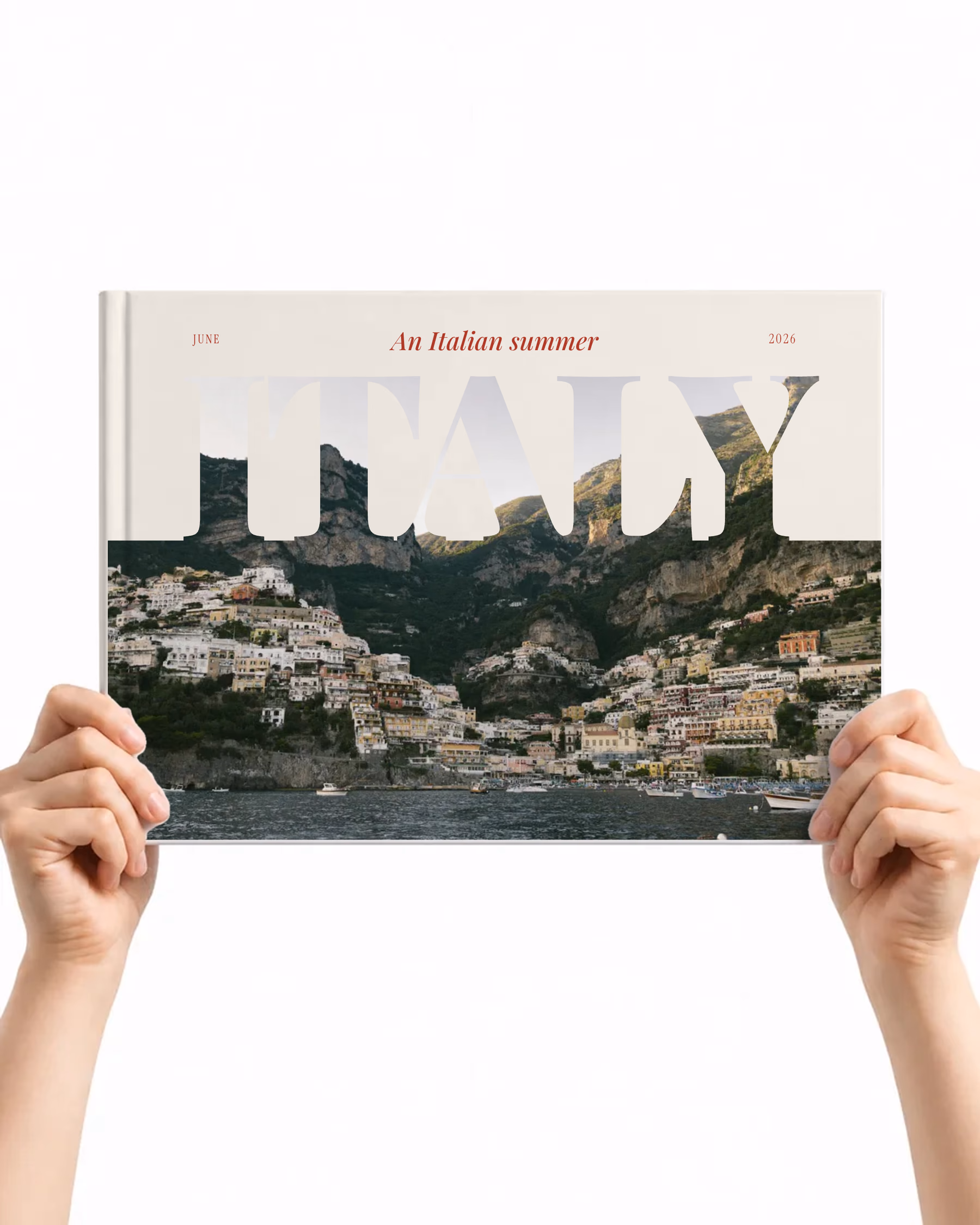 Landscape layflat photo book with the Poster cover, large ITALY lettering over a photo of the Amalfi Coast, held up in two hands