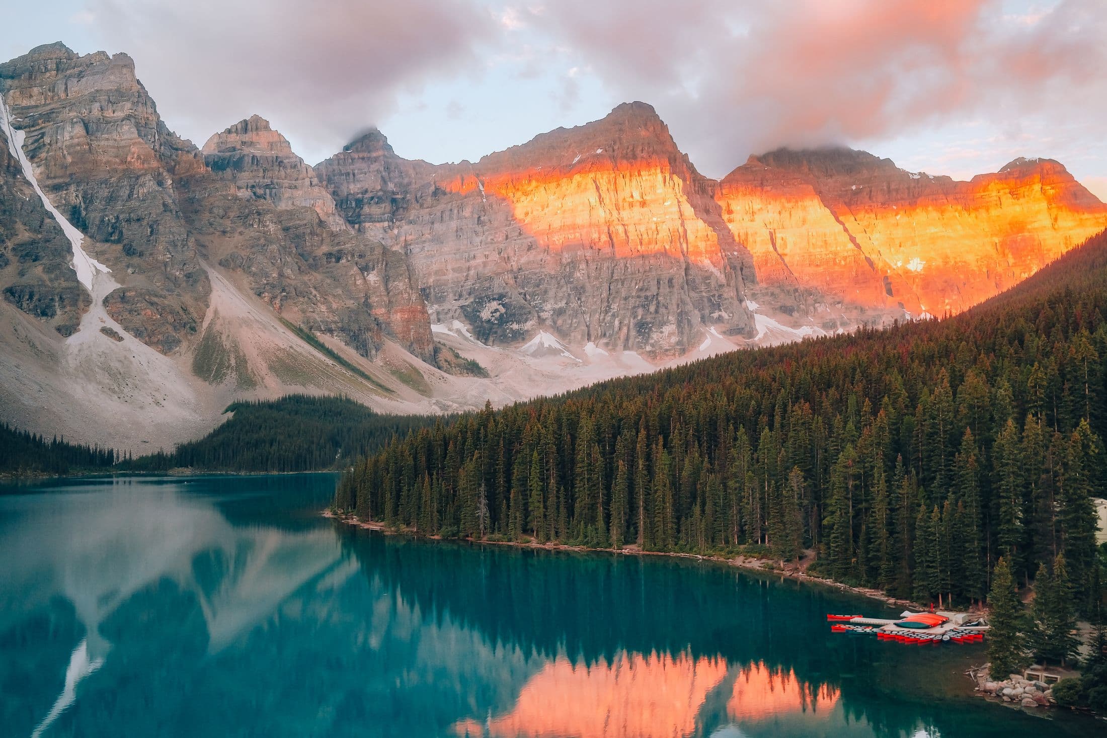 Sunrise light glowing across the Valley of the Ten Peaks above Moraine Lake in Banff National Park