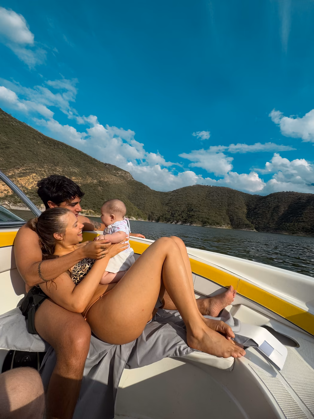 A family laughing together on a boat