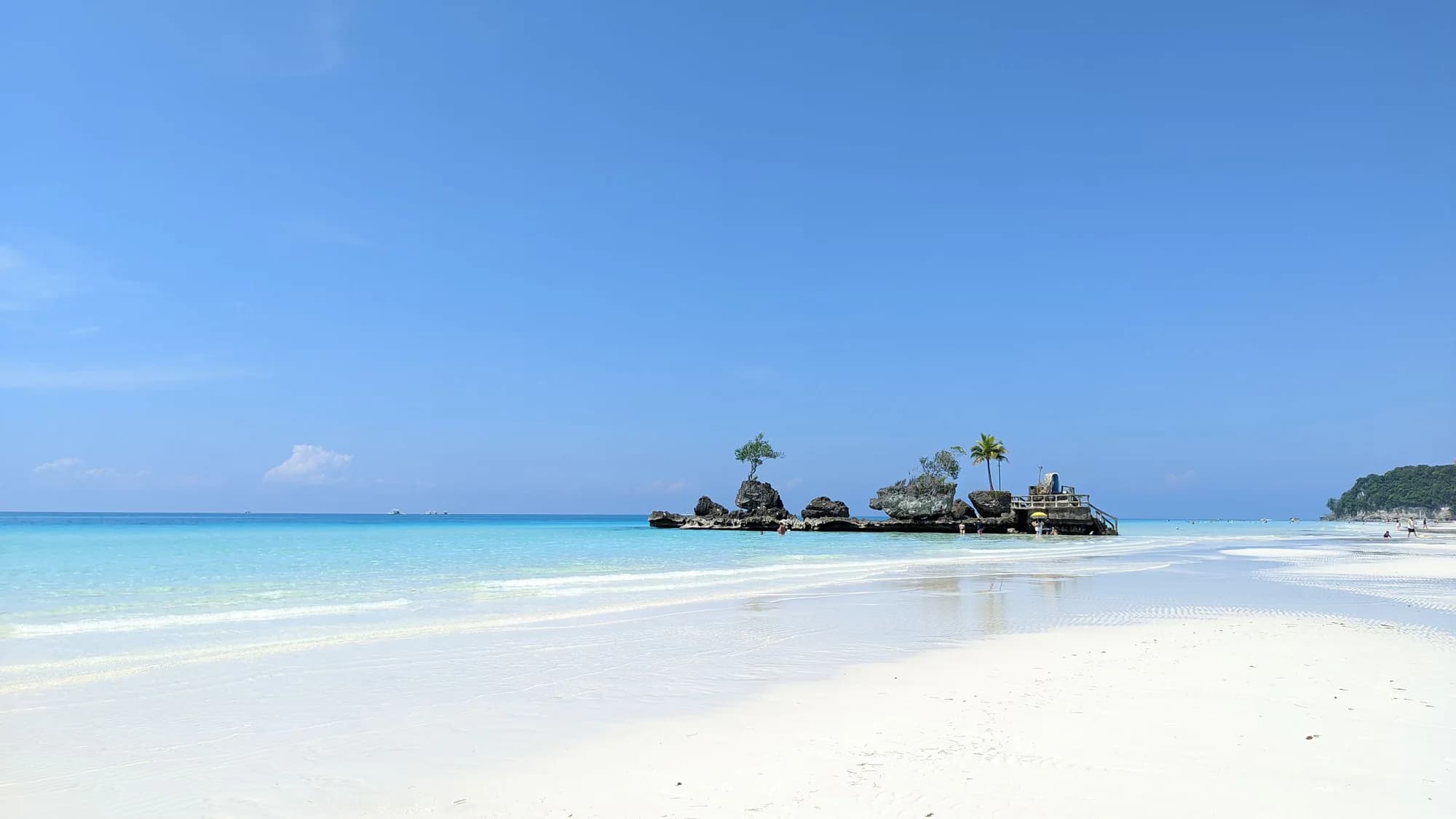 Traveller photographing a bright coastal destination