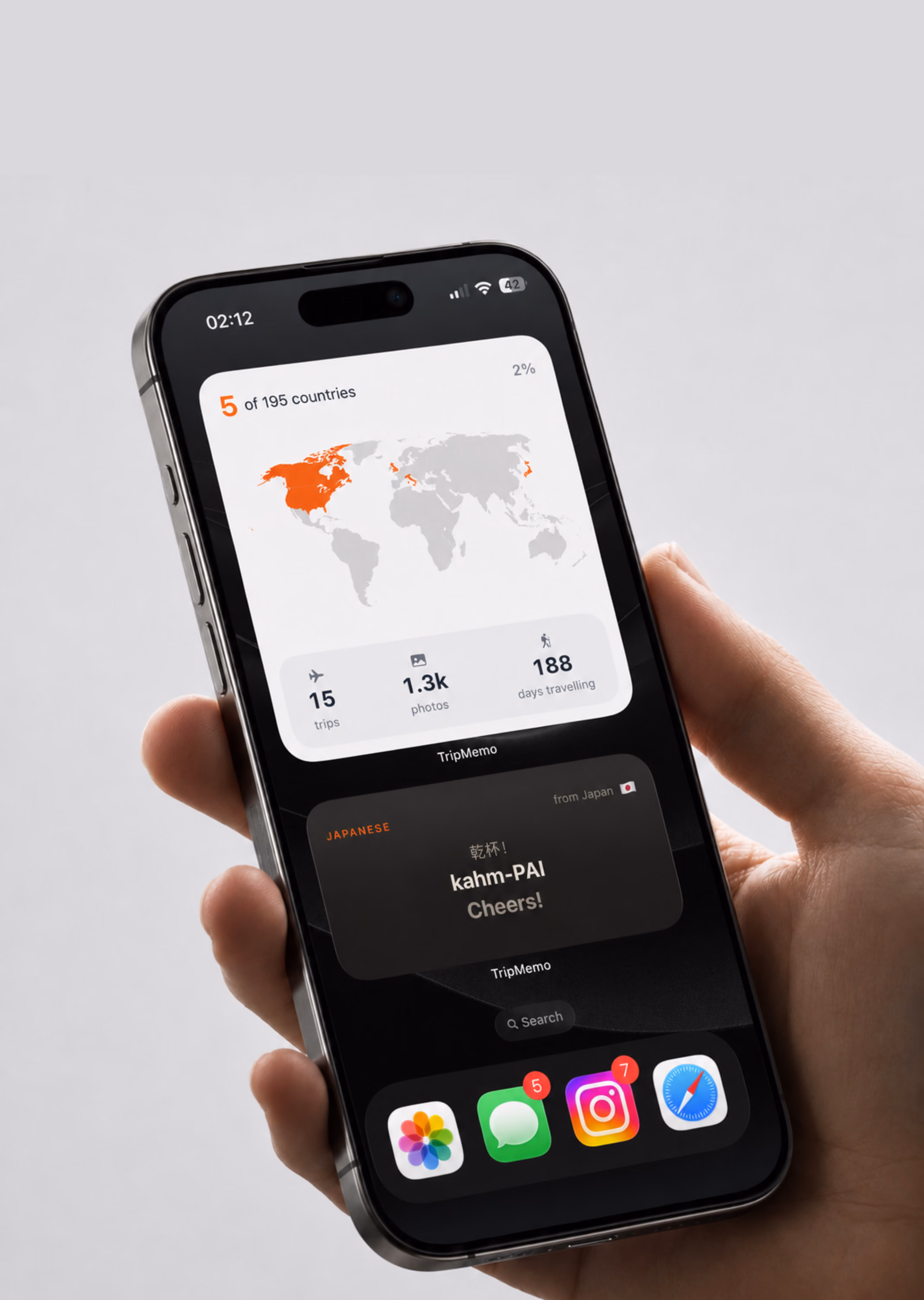 Hand holding an iPhone with TripMemo Home Screen widgets showing visited countries, trips, photos and travel days