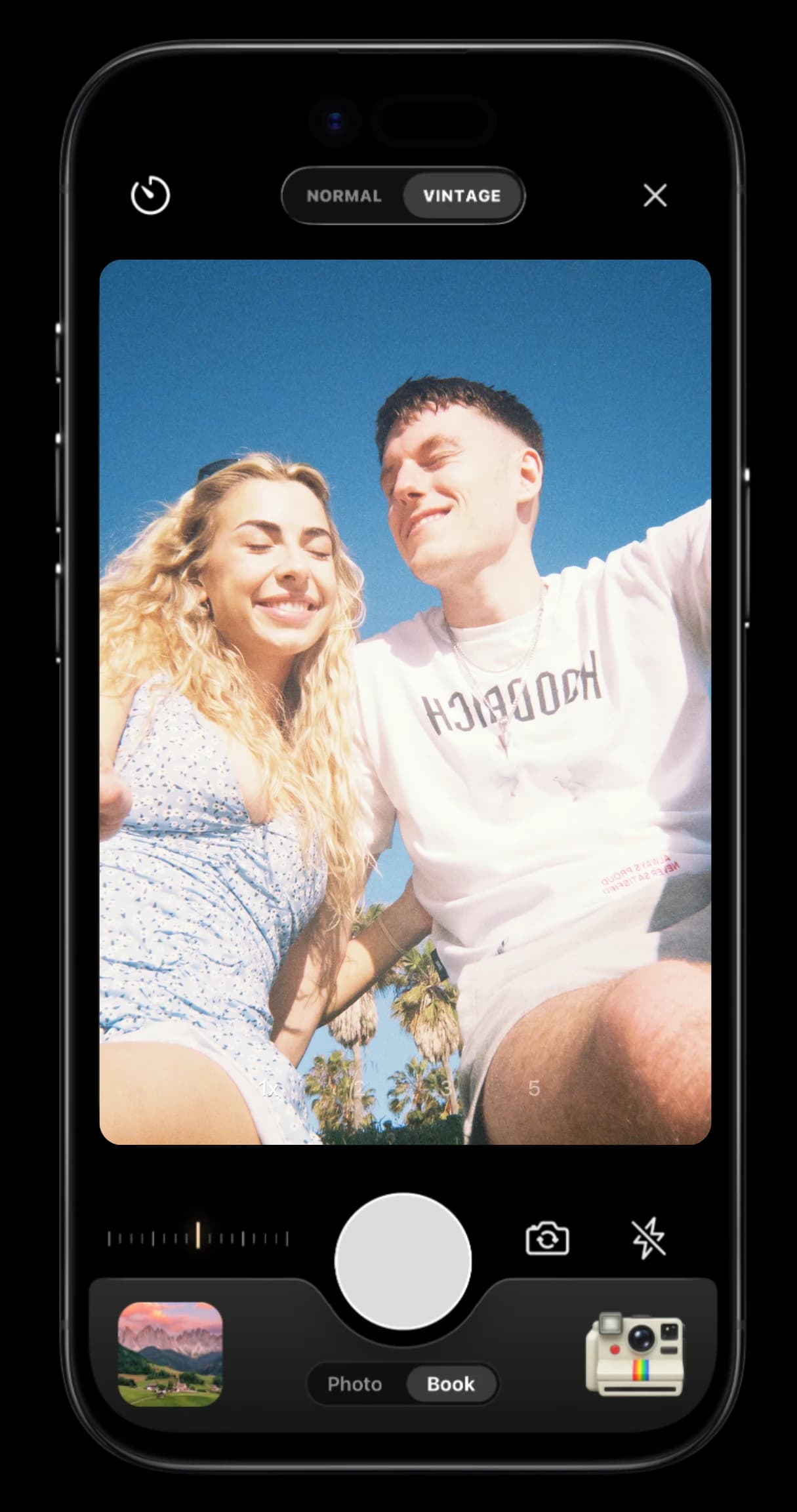 TripMemo vintage film camera on iPhone framing a sunny portrait with a warm film look