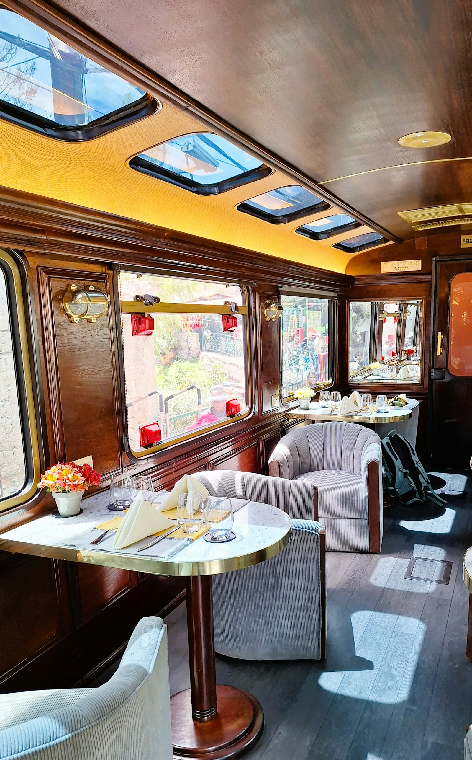 Luxury train dining carriage with tables set for a heritage rail journey