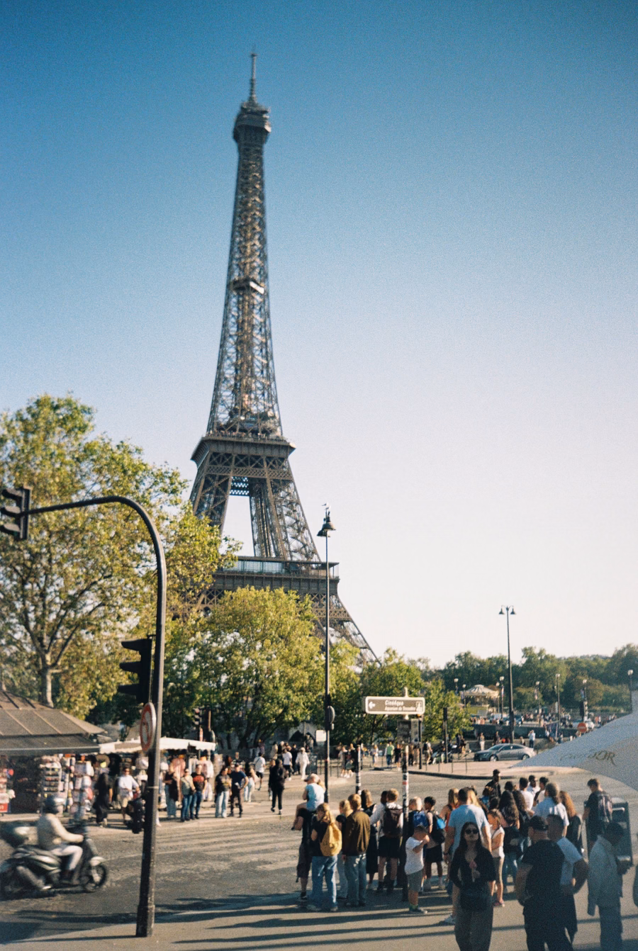 Eiffel Tower rising above a busy Paris street